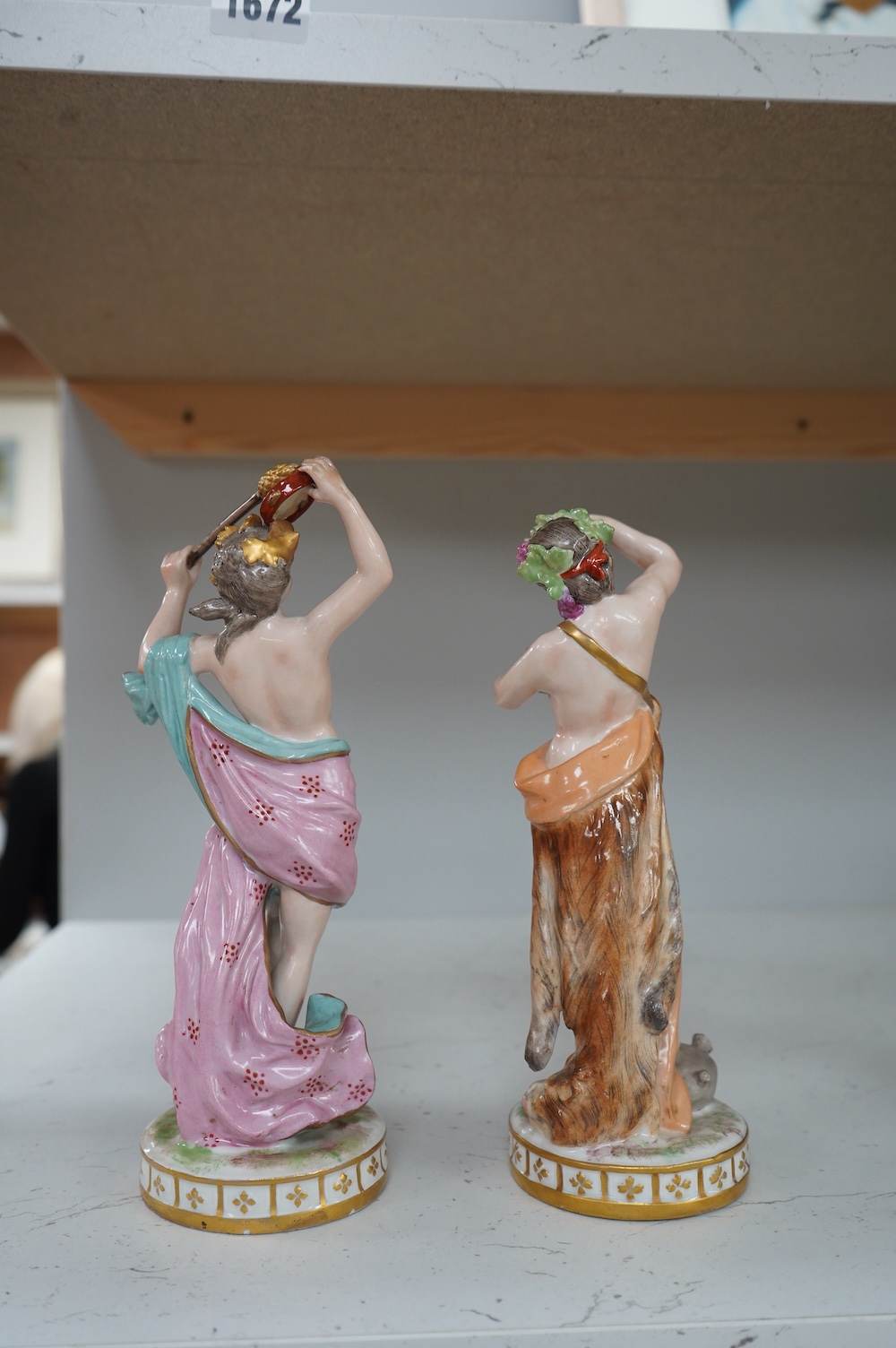 A pair of German porcelain figures, 22cm. Condition - fair to good